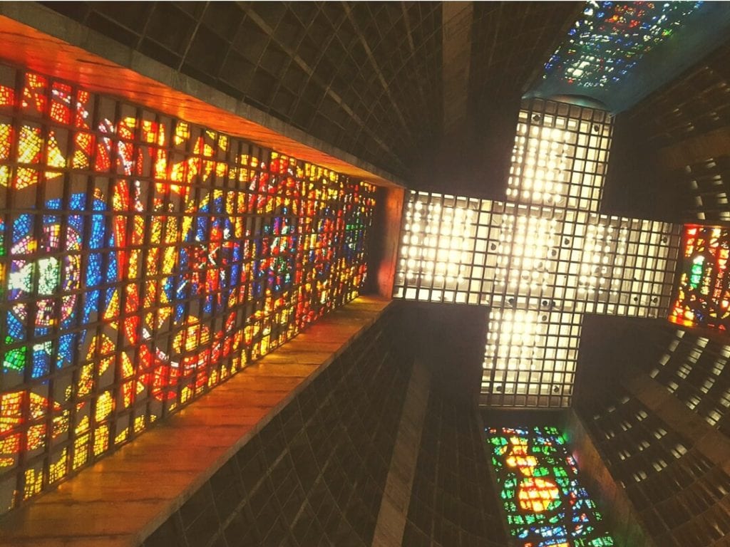 A photo of the colourful stained glass interior of Saint Sebastian Cathedral, Rio