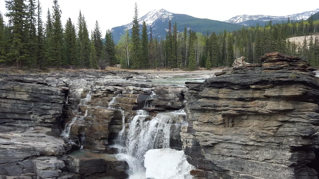 spring-snow-athabasca-waterfall-jasper-canada