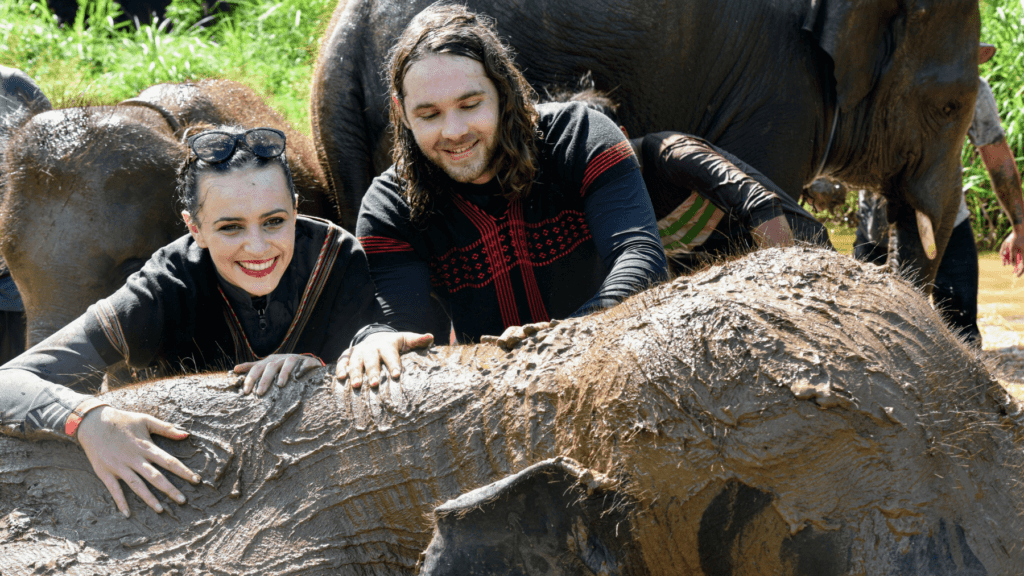 An-image-of-a-couple-taking-a-mudbath-with-elephants-at-Rantong-the-best-place-to-see-elephants-in-chiang-mai
