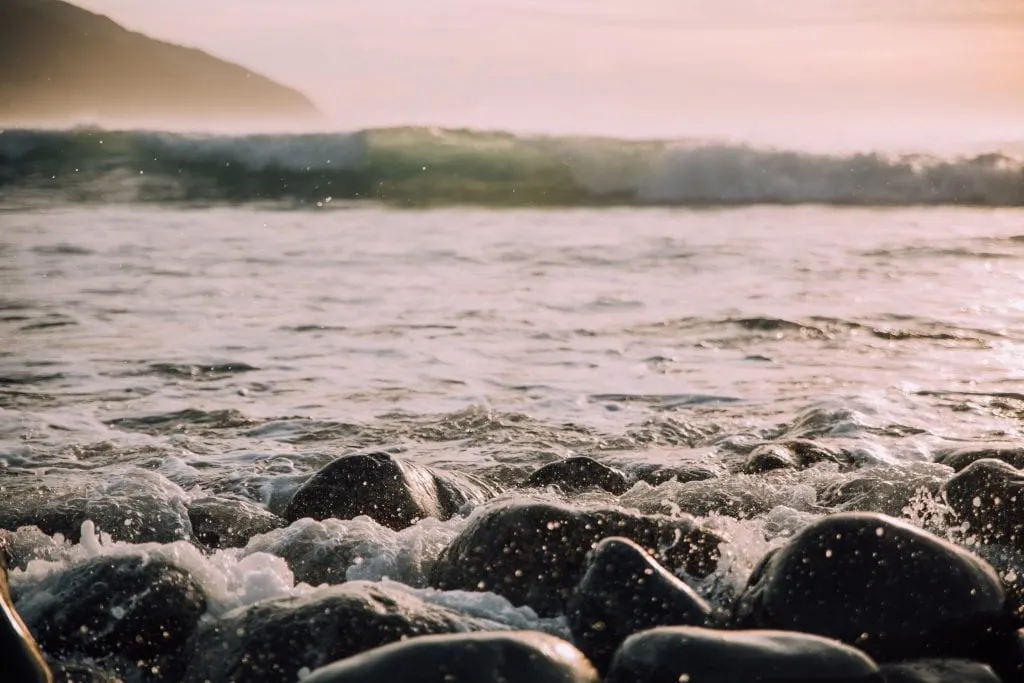 black-pebble-beach-in-kaikora-new-zealand