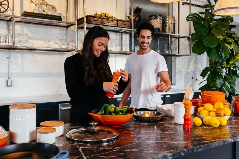 Couples cooking together is a fun indoor date